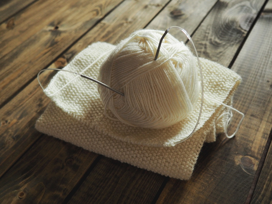 Knitting Yarn on Wooden Background